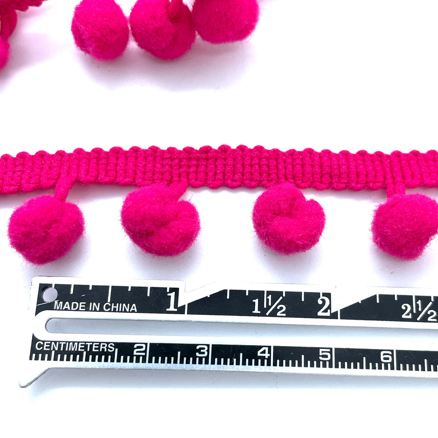 cerise pom pom trim idea for cushions, curtains or anywhere that needs a little extra wow
