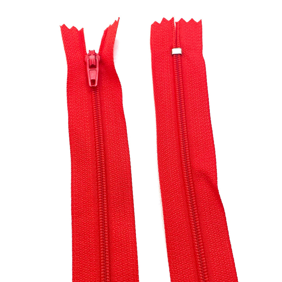 Photo of red nylon zips available in 25 colors and 5 sizes. Excellent quality zippers for craft and dressmaking purposes. Perfect for dresses, skirts, trousers, bags, purses, cushions, and numerous other projects. So many possibilities, so little time!
