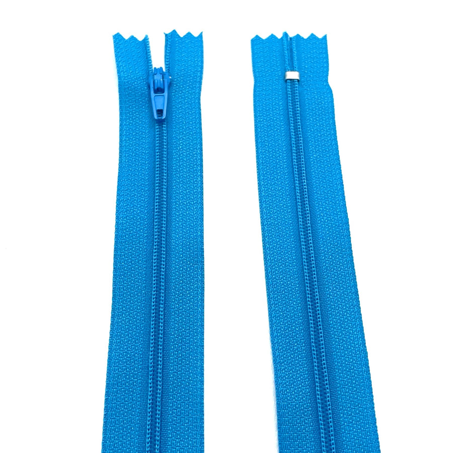 Photo of turquoise nylon zips available in 25 colors and 5 sizes. Excellent quality zippers for craft and dressmaking purposes. Perfect for dresses, skirts, trousers, bags, purses, cushions, and numerous other projects. So many possibilities, so little time!