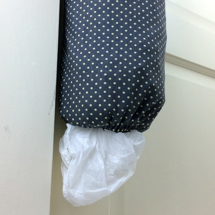 plastic bag dispenser and holder for those pesky bags for life that take over this one is a  grey spotted canvas fabric