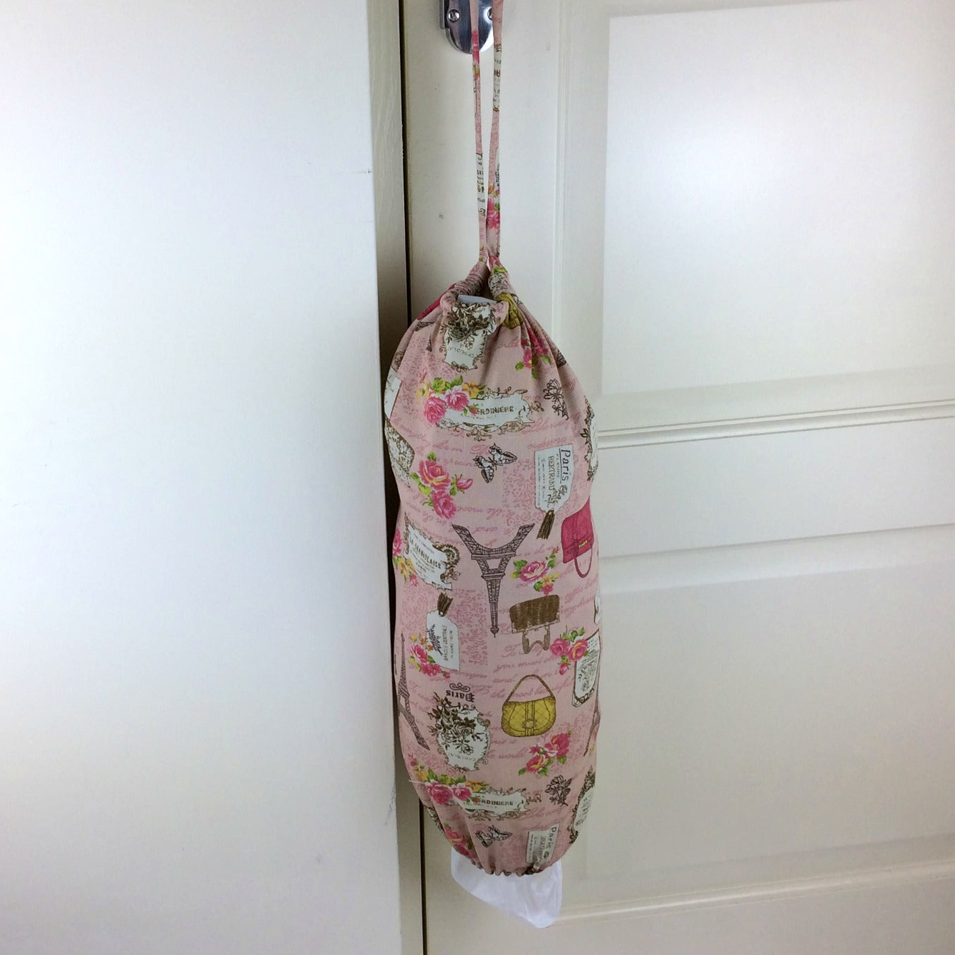 plastic bag dispenser and holder for those pesky bags for life that take over this one is a pink paris theme canvas fabric