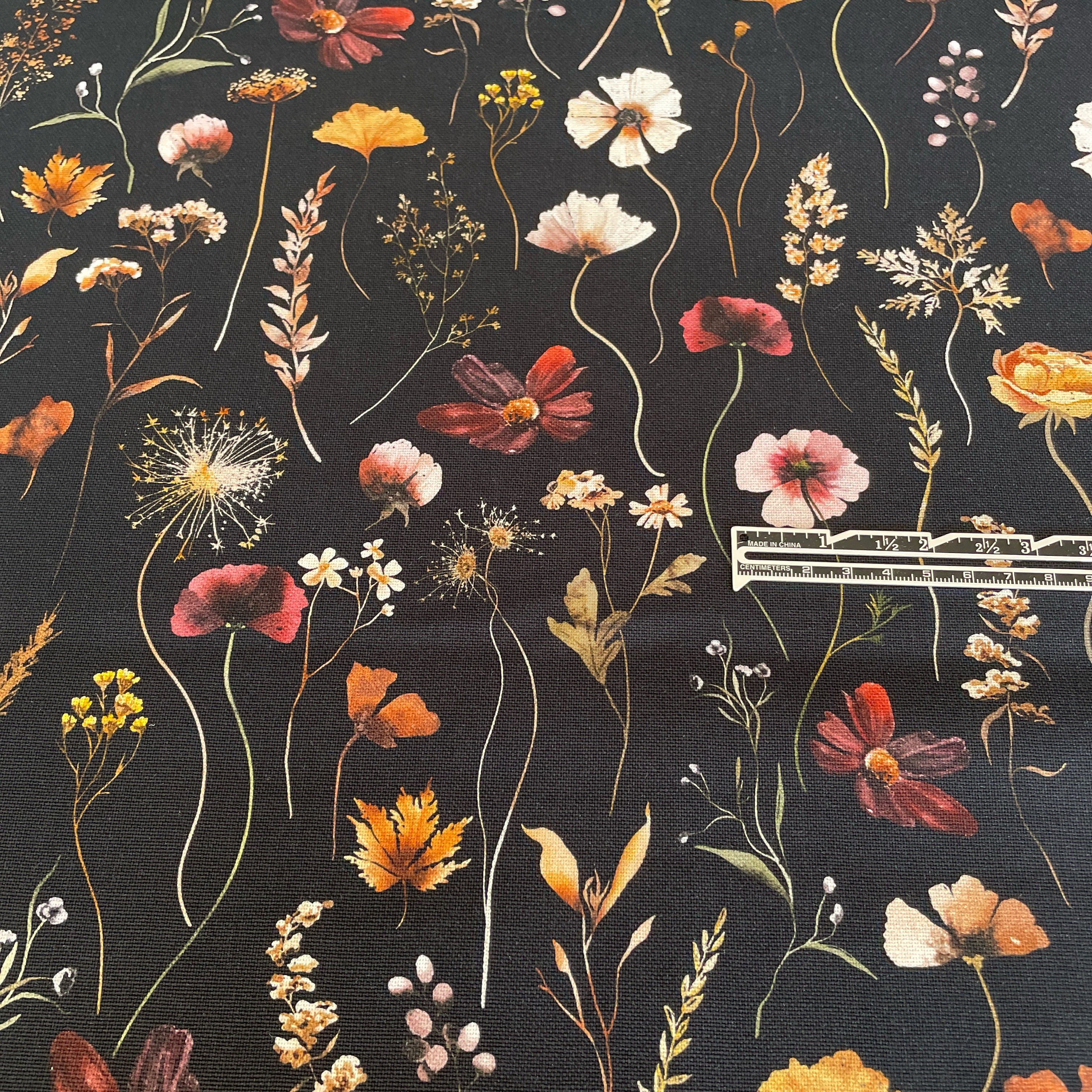 This stunning digitally printed 100% cotton floral design on a black background canvas &nbsp; It is a hardwearing Cotton woven canvas fabric, ideal for clothes, canvas bags, upholstery, etc