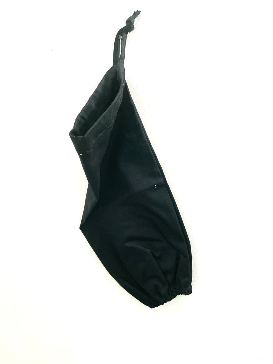 Elasticated bottom of the plastic bag holders in black drill fabric