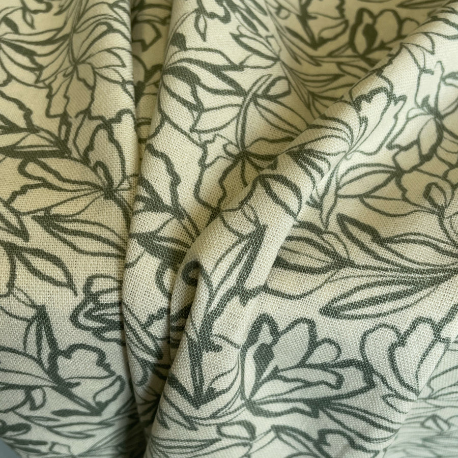 ecru fabric is made from a blend of linen and washed viscose, resulting in a luxurious and soft texture. It features a beautiful design that is both elegant and understated, making it perfect for a wide range of dressmaking projects