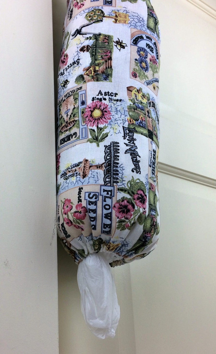 plastic bag dispenser and holder for those pesky bags for life that take over this one is green gardening theme