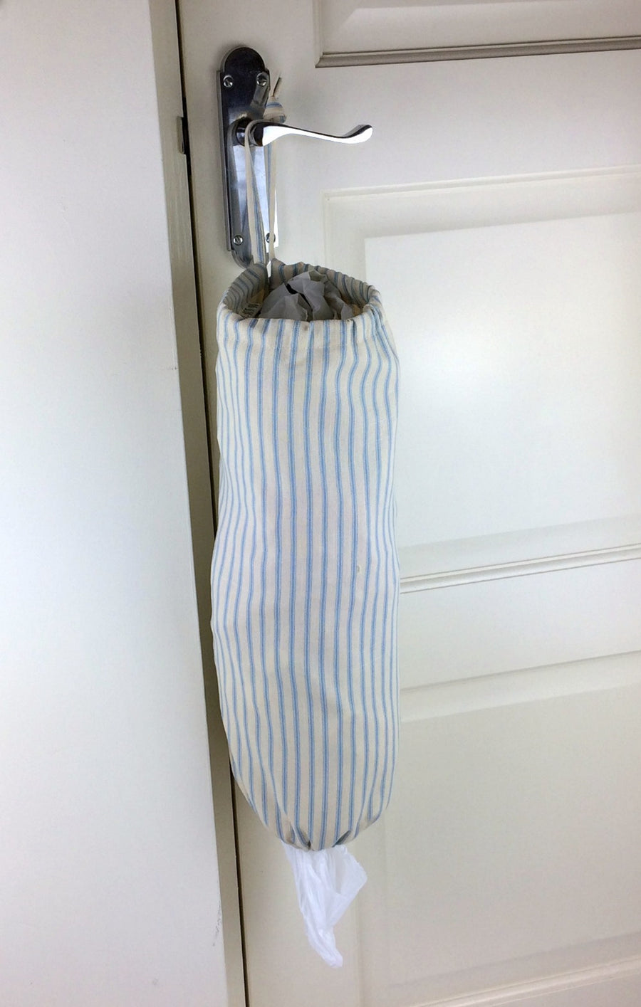 plastic bag dispenser and holder for those pesky bags for life that take over this one is light blue ticking stripe