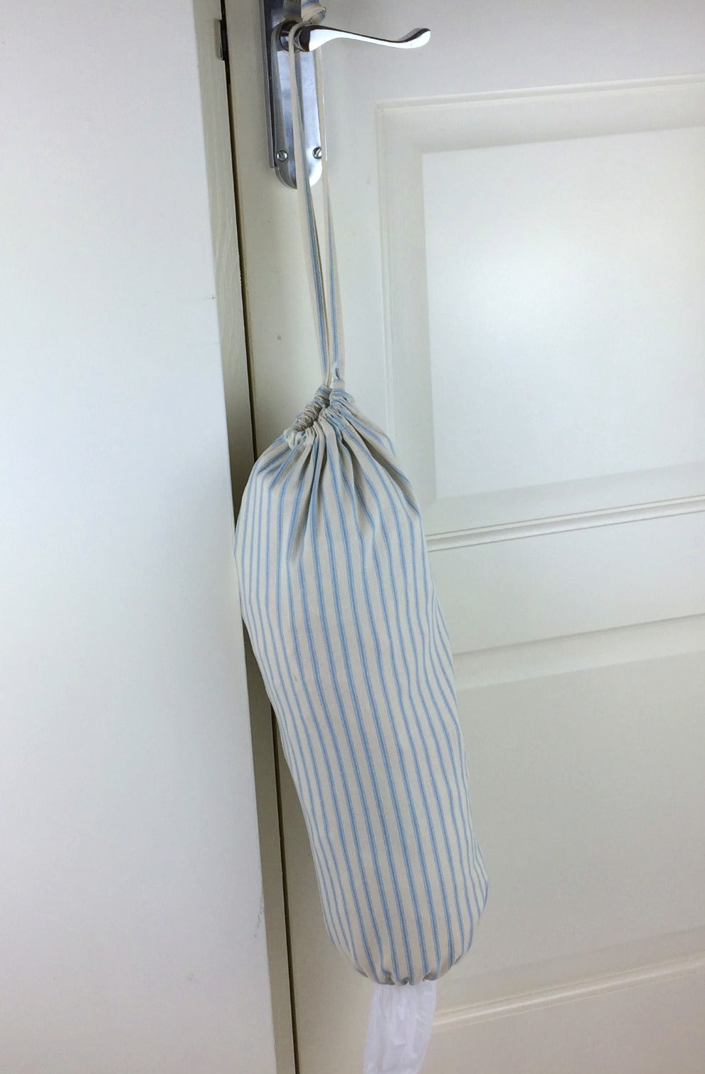 plastic bag dispenser and holder for those pesky bags for life that take over this one is light blue ticking stripe