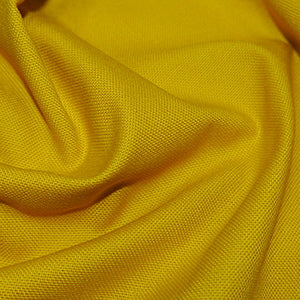 canvas fabric in a mustard or ochre colour.  Medium weight with a good drape
