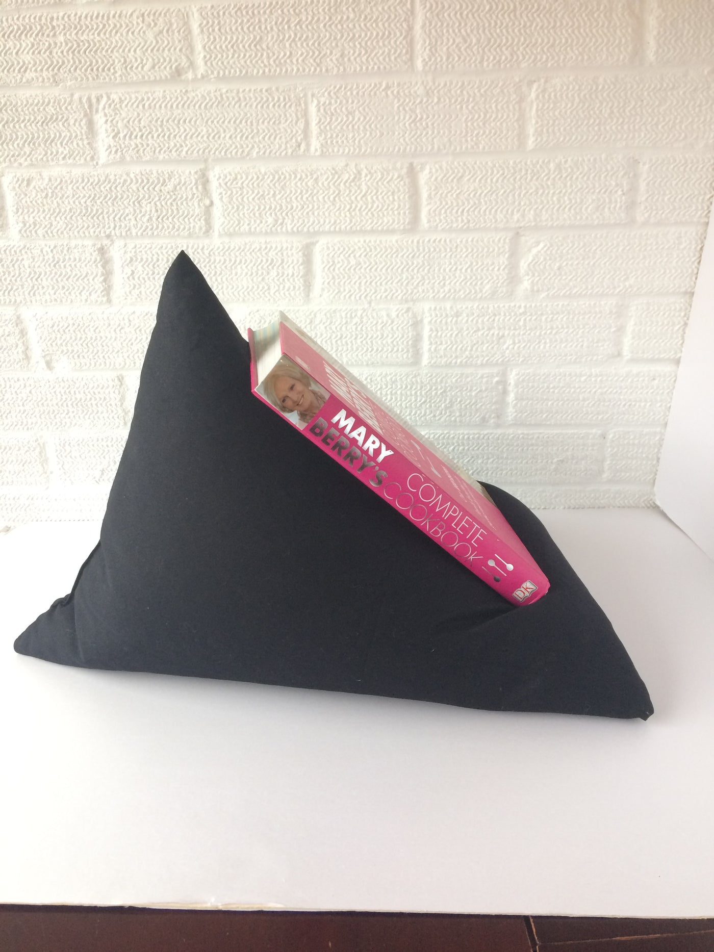 Black drill fabric Book holder bean bag style to hold your books where ever you need them.