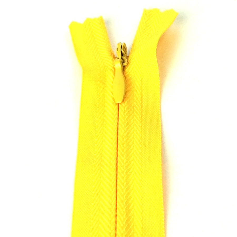 Photo of daffodil yellow invisible or concealed zips available in many different colours and sizes. Great for achieving a professional finish in your products. Invisible zippers are perfect for dressmaking, cushions, crafts, etc., where you don't want your zipper showing. Installing them can be tricky without the right foot on your machine; a normal zipper foot is for installing standard zippers, while you will need an invisible zipper foot for a professional result