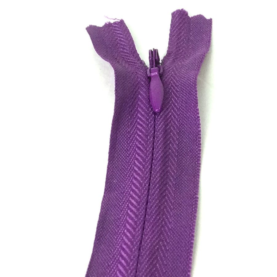 Photo of  dusky purple invisible or concealed zips available in many different colours and sizes. Great for achieving a professional finish in your products. Invisible zippers are perfect for dressmaking, cushions, crafts, etc., where you don't want your zipper showing. Installing them can be tricky without the right foot on your machine; a normal zipper foot is for installing standard zippers, while you will need an invisible zipper foot for a professional result