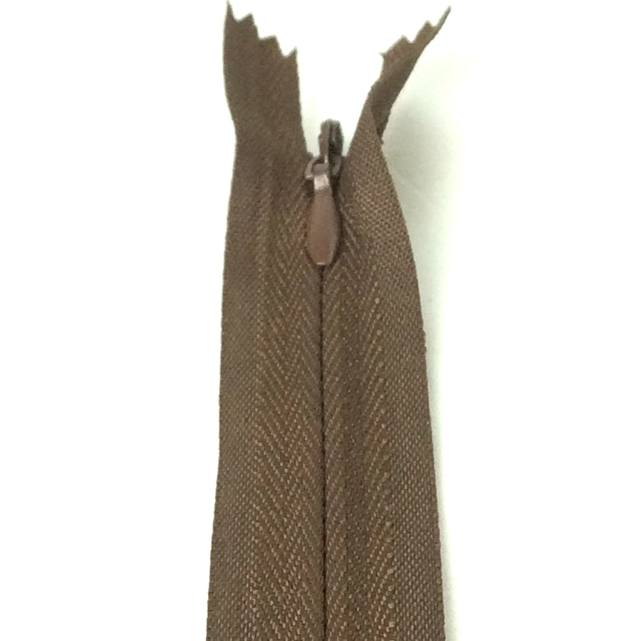 Photo of brown invisible or concealed zips available in many different colours and sizes. Great for achieving a professional finish in your products. Invisible zippers are perfect for dressmaking, cushions, crafts, etc., where you don't want your zipper showing. Installing them can be tricky without the right foot on your machine; a normal zipper foot is for installing standard zippers, while you will need an invisible zipper foot for a professional result