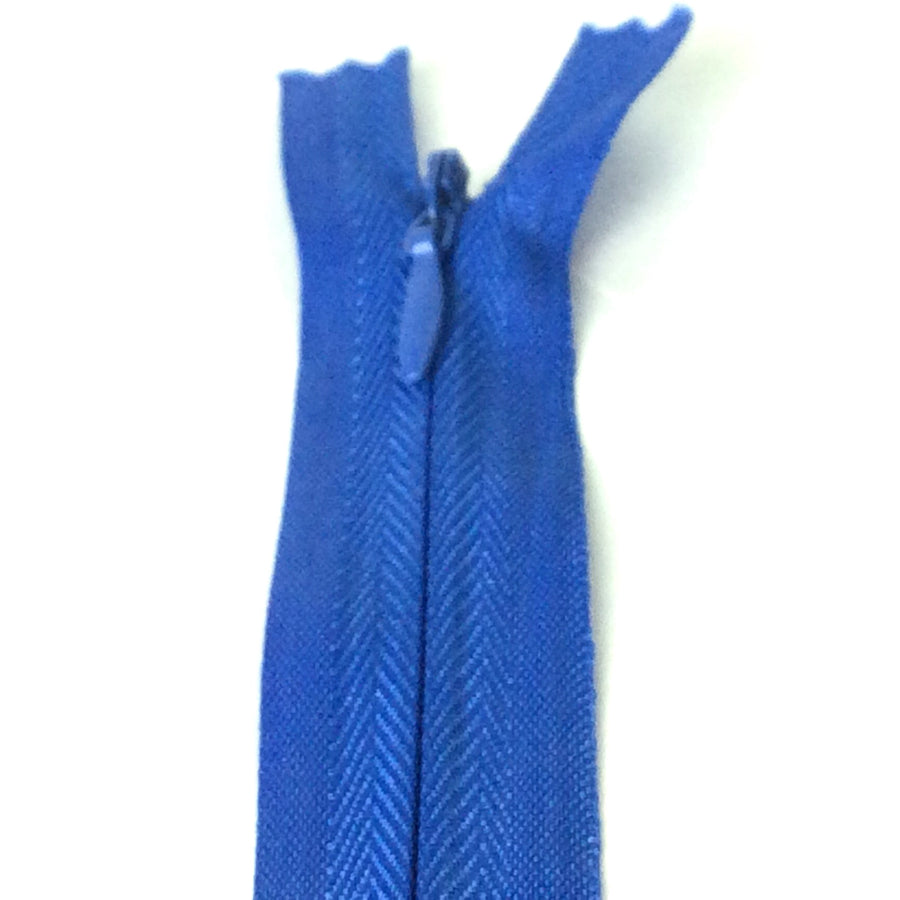 Photo of royal blue invisible or concealed zips available in many different colours and sizes. Great for achieving a professional finish in your products. Invisible zippers are perfect for dressmaking, cushions, crafts, etc., where you don't want your zipper showing. Installing them can be tricky without the right foot on your machine; a normal zipper foot is for installing standard zippers, while you will need an invisible zipper foot for a professional result