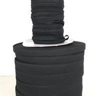 High-quality flat woven elastic in black, perfect for waistbands, cuffs, crafts, and general sewing projects. Offers excellent durability and elasticity for a wide range of applications, ensuring comfort and reliability in your creations
