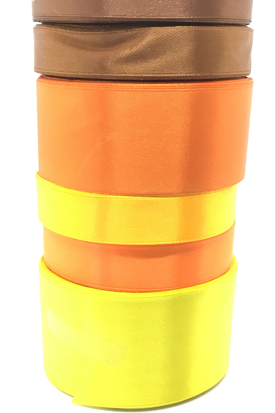 all orange and browns stack of single faced ribbon for crafts and ribbon making