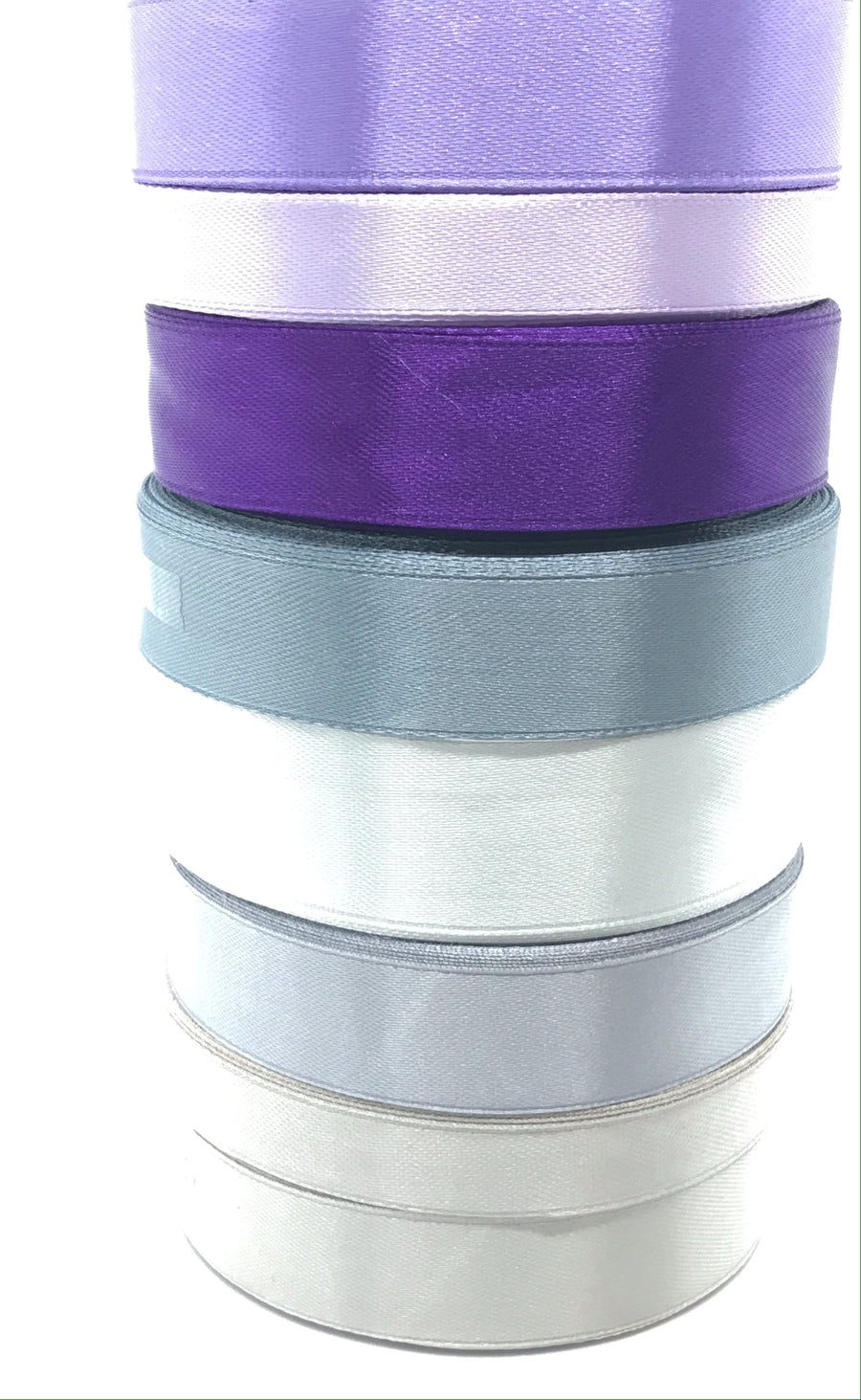stack of purple to silver singel faced ribbons for crafts