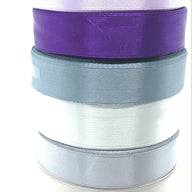 purple and grey stack of single faced ribbon for crafts and ribbon making