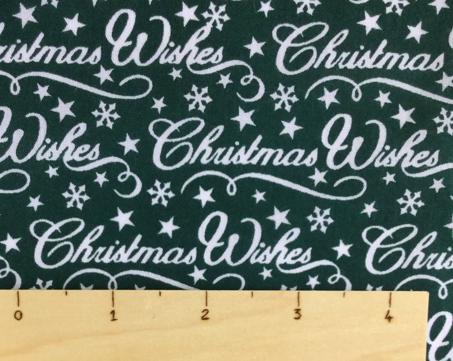 Green christmas poly cotton fabric with Christmas wishes printed 