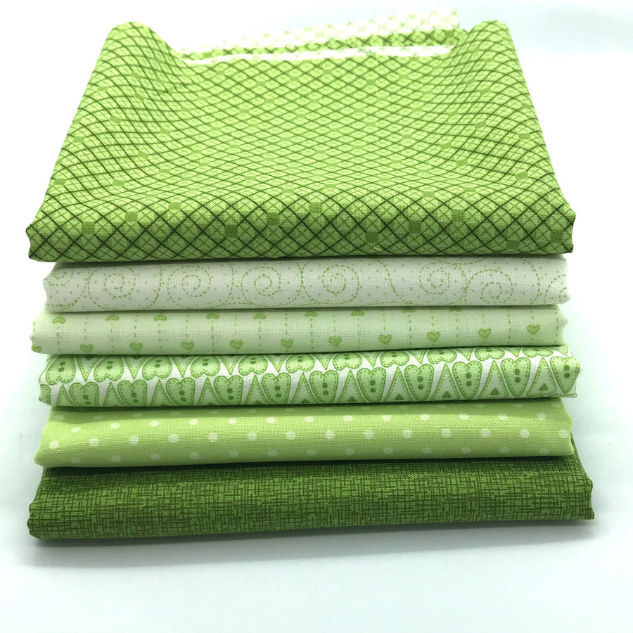 Photo of green fat quarter bundle in the red rooster basically hugs collection