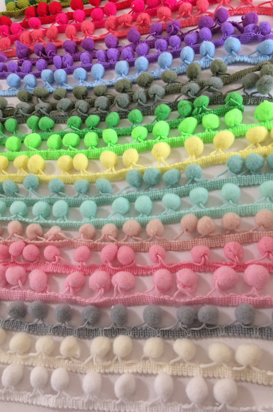 pom pom trim in a rainbow of colours.