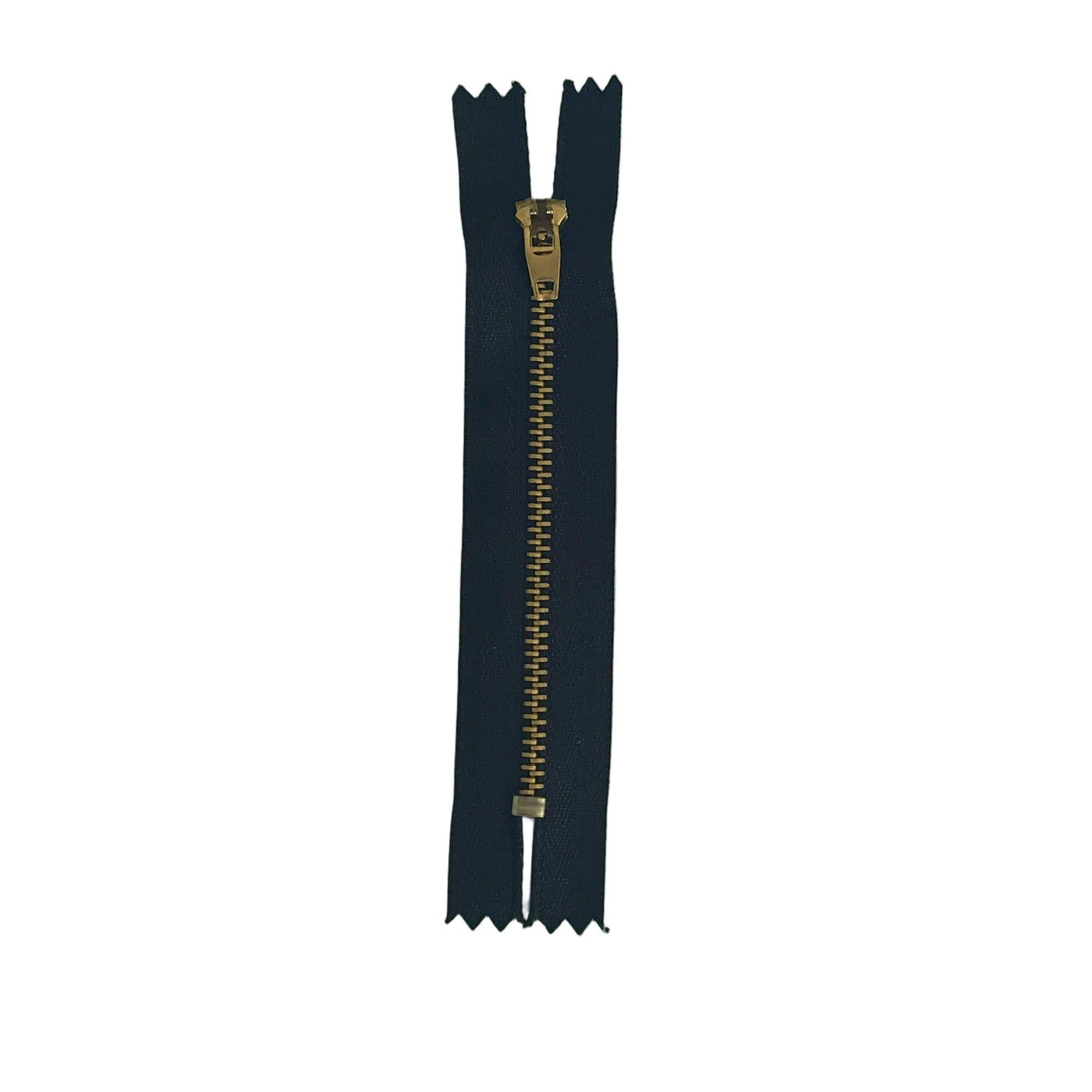 A single black zipper with a gold-toned pull tab, laid vertically on a textured white paper background.