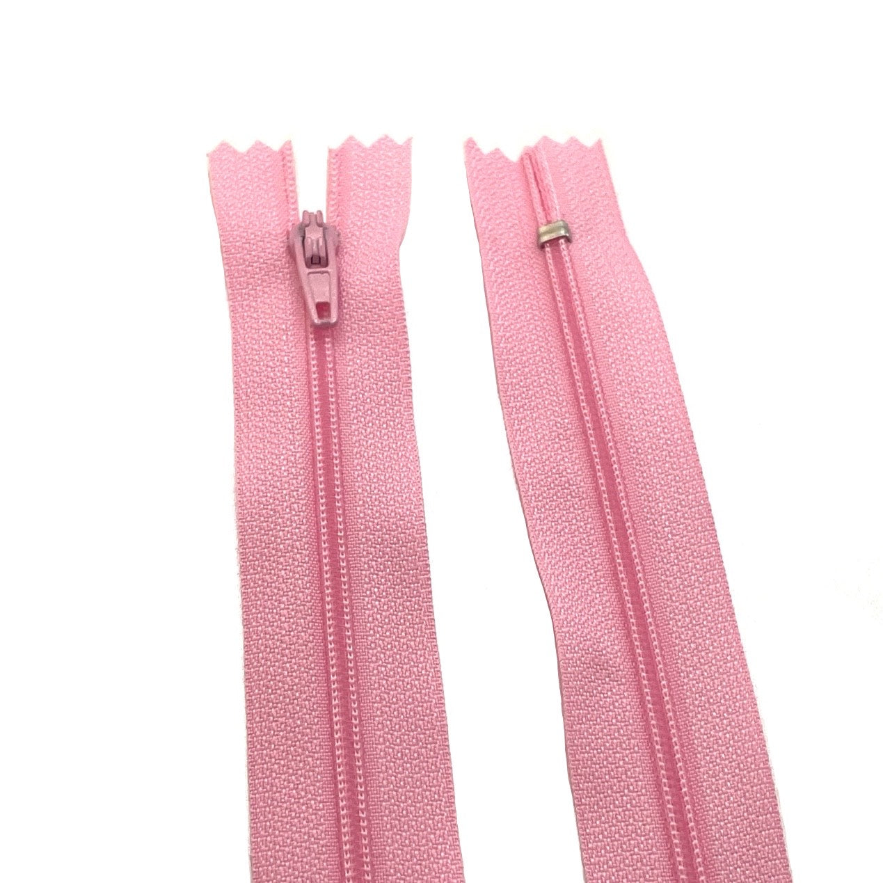 Photo of light pink nylon zips available in 25 colors and 5 sizes. Excellent quality zippers for craft and dressmaking purposes. Perfect for dresses, skirts, trousers, bags, purses, cushions, and numerous other projects. So many possibilities, so little time!
