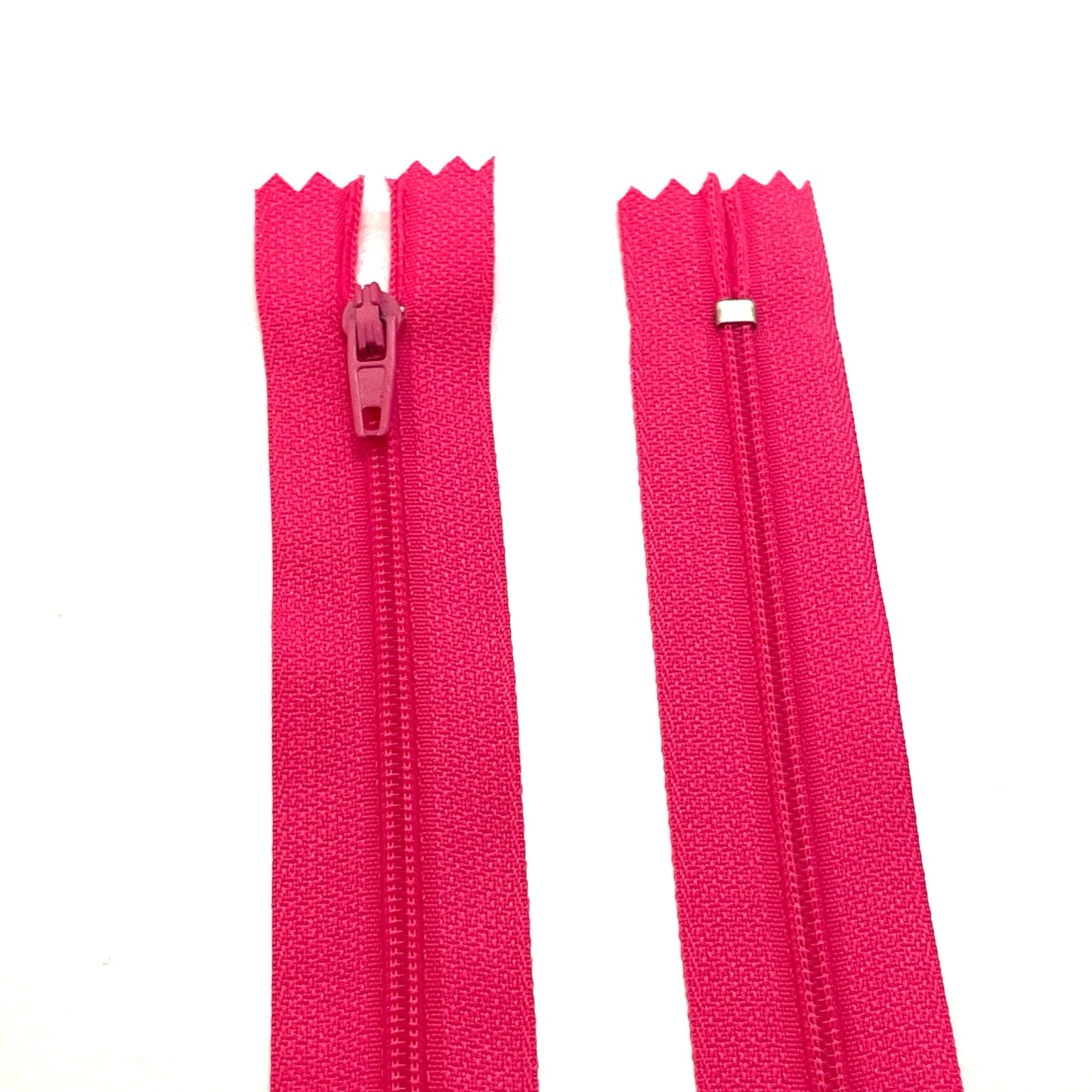 Photo of pink nylon zips available in 25 colors and 5 sizes. Excellent quality zippers for craft and dressmaking purposes. Perfect for dresses, skirts, trousers, bags, purses, cushions, and numerous other projects. So many possibilities, so little time!