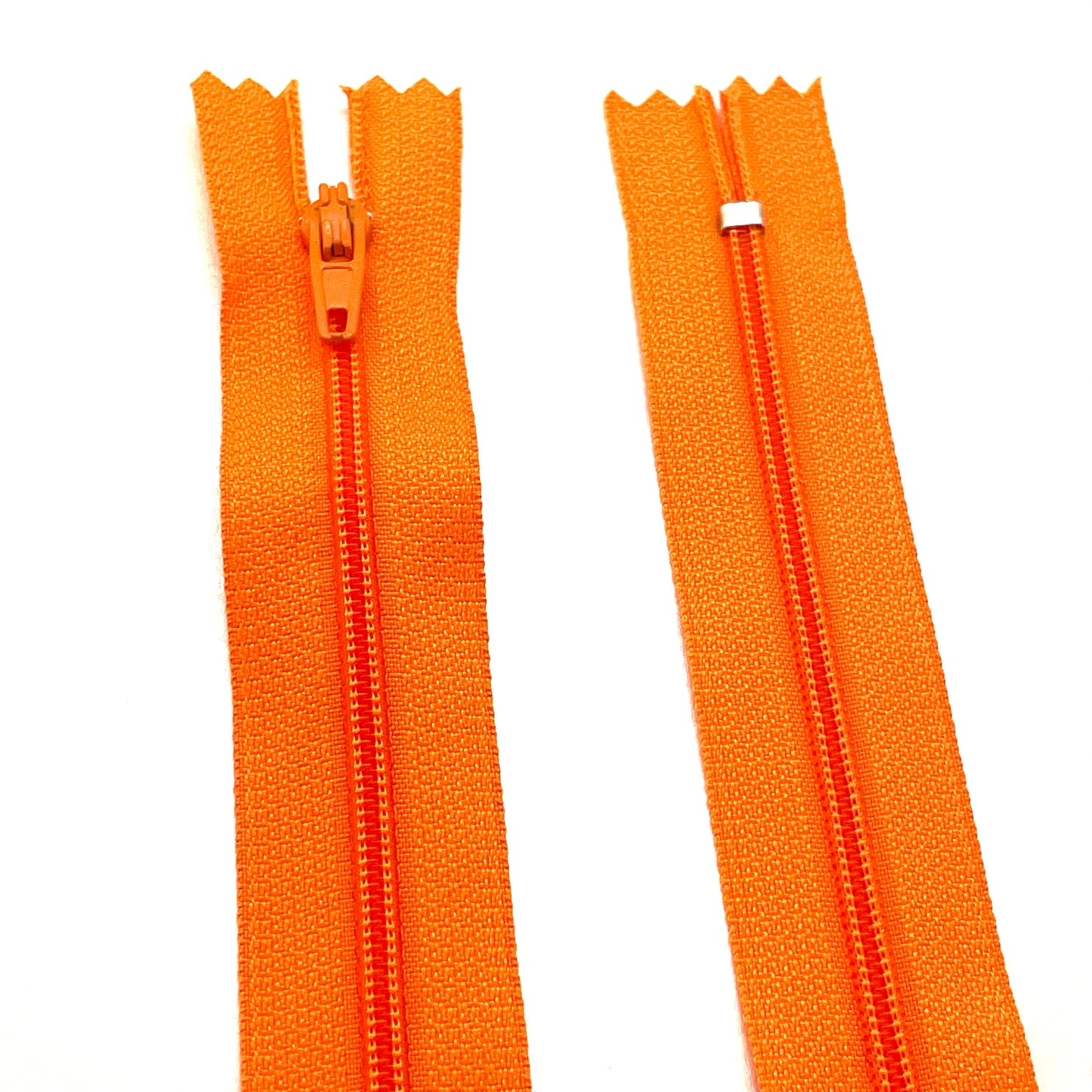 Photo of orange nylon zips available in 25 colors and 5 sizes. Excellent quality zippers for craft and dressmaking purposes. Perfect for dresses, skirts, trousers, bags, purses, cushions, and numerous other projects. So many possibilities, so little time!