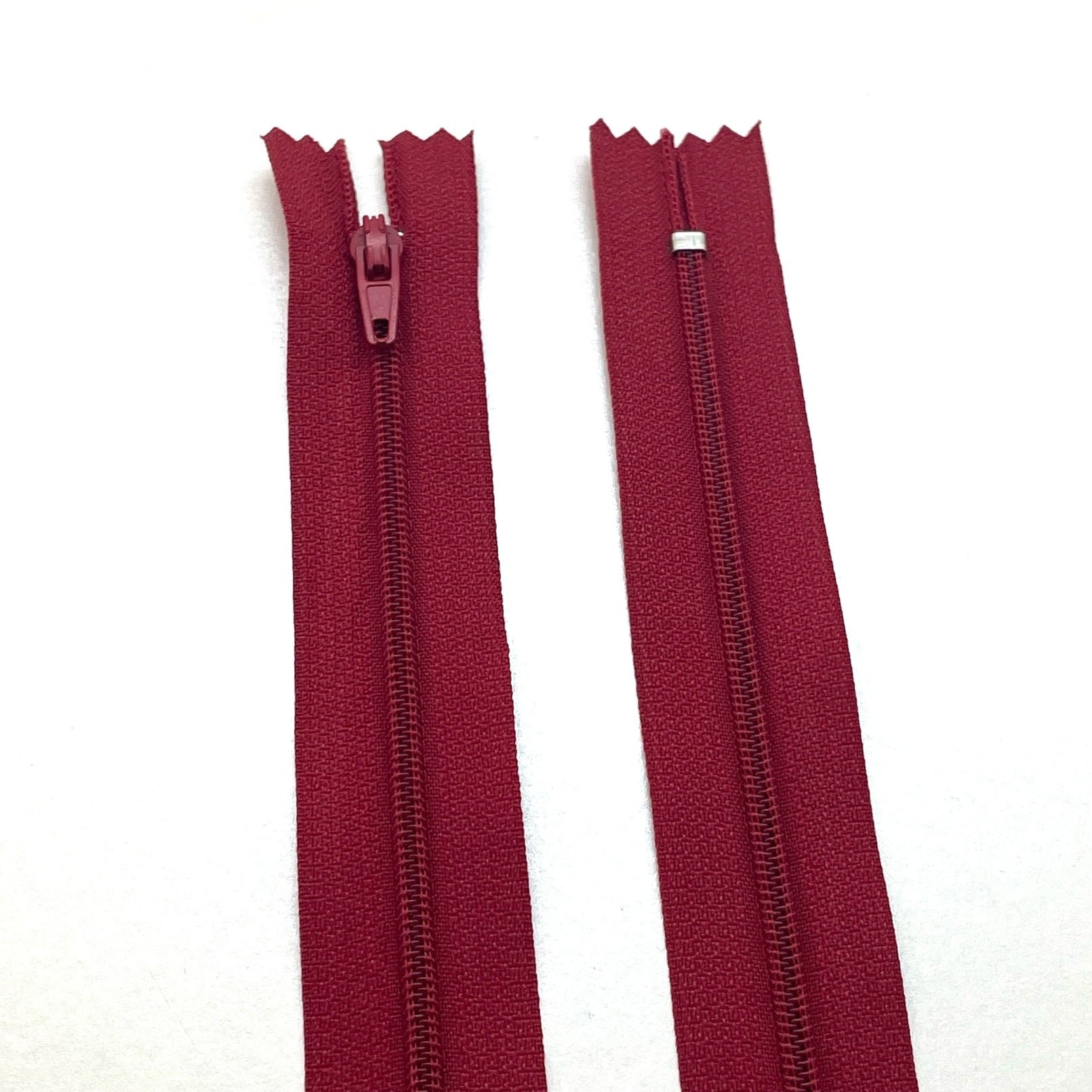 Photo of red burgundy nylon zips available in 25 colors and 5 sizes. Excellent quality zippers for craft and dressmaking purposes. Perfect for dresses, skirts, trousers, bags, purses, cushions, and numerous other projects. So many possibilities, so little time!