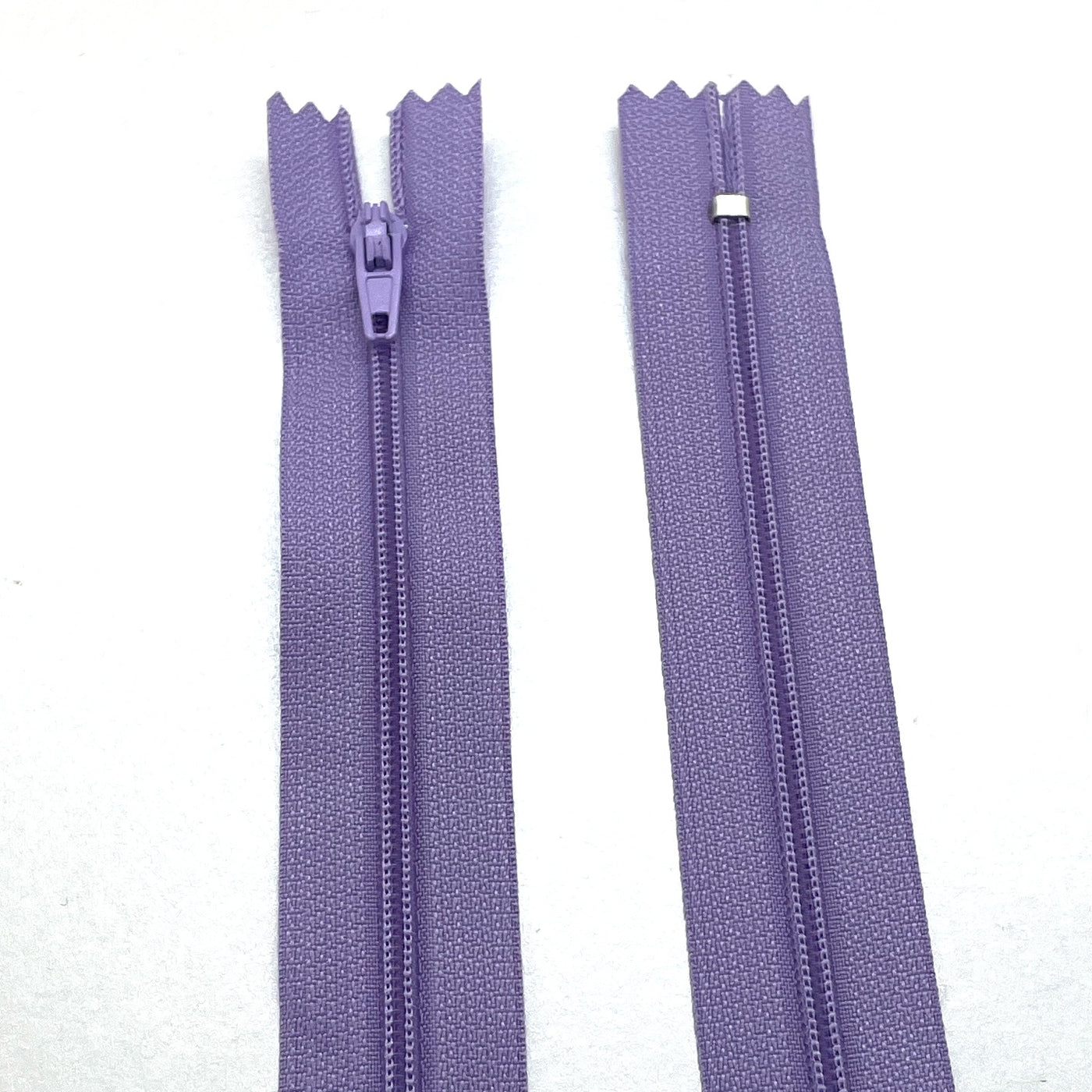 Photo of lilac nylon zips available in 25 colors and 5 sizes. Excellent quality zippers for craft and dressmaking purposes. Perfect for dresses, skirts, trousers, bags, purses, cushions, and numerous other projects. So many possibilities, so little time!