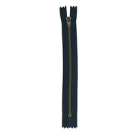 A single long zipper shown vertically on a plain white background, with dark navy fabric sides and a gold-toned metal pull tab and teeth.