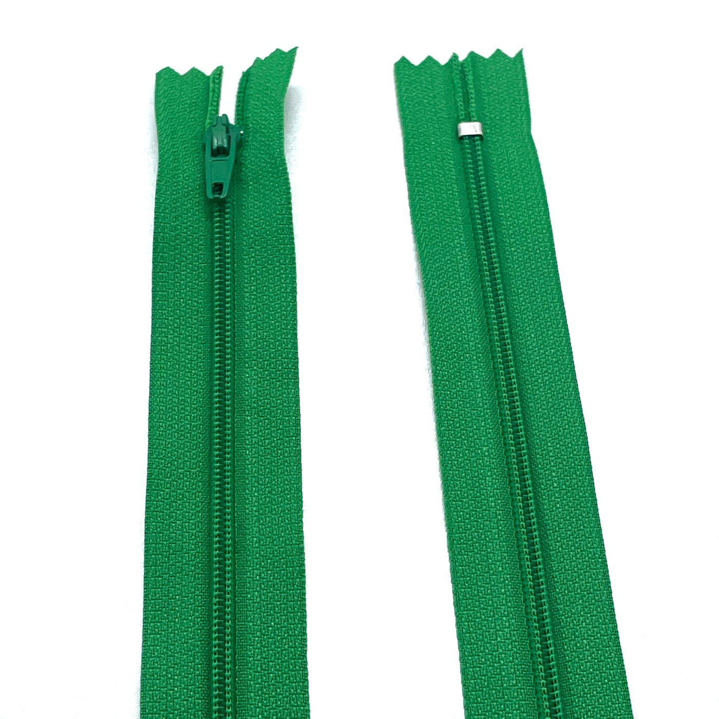 Photo of green nylon zips available in 25 colors and 5 sizes. Excellent quality zippers for craft and dressmaking purposes. Perfect for dresses, skirts, trousers, bags, purses, cushions, and numerous other projects. So many possibilities, so little time!