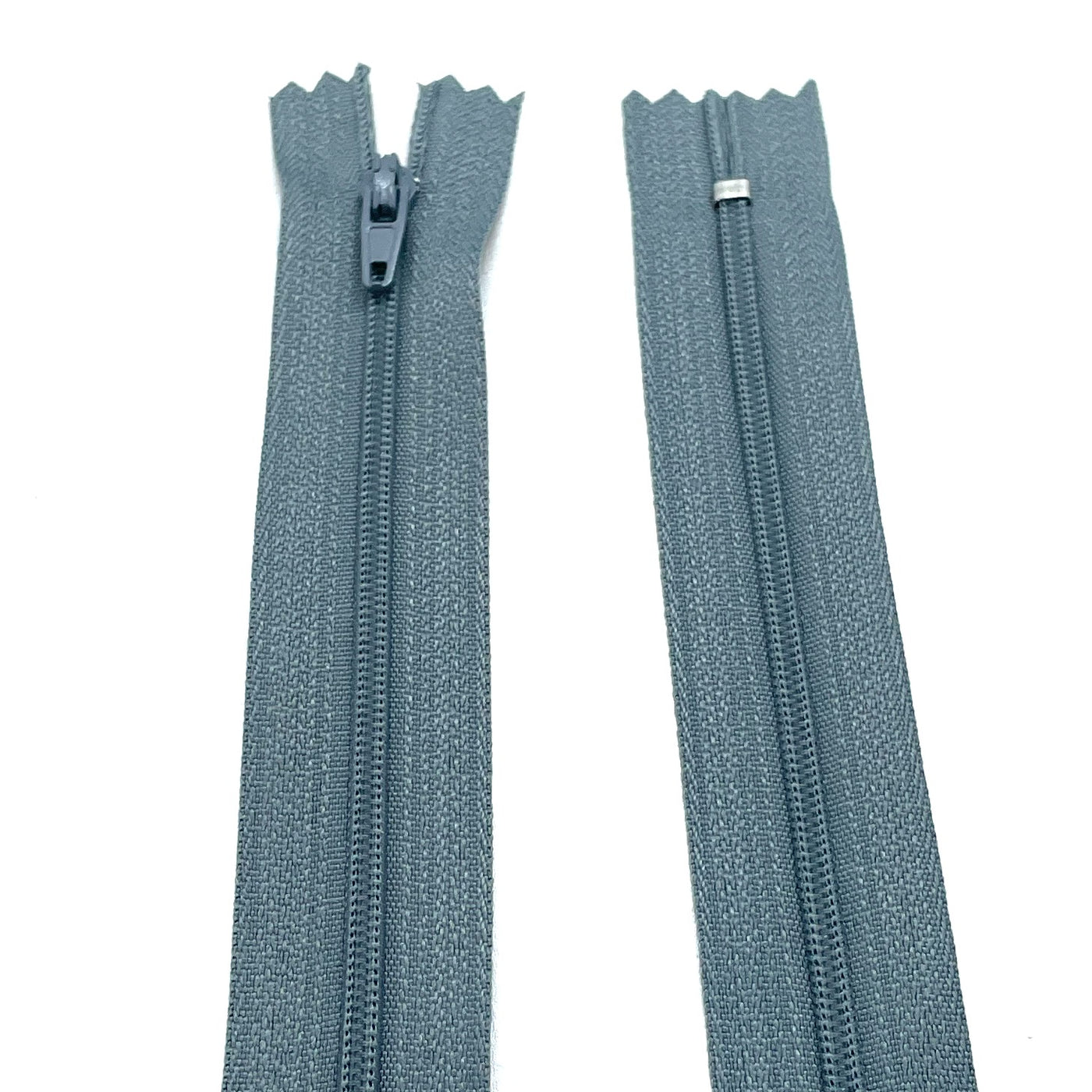 Photo of grey nylon zips available in 25 colors and 5 sizes. Excellent quality zippers for craft and dressmaking purposes. Perfect for dresses, skirts, trousers, bags, purses, cushions, and numerous other projects. So many possibilities, so little time!