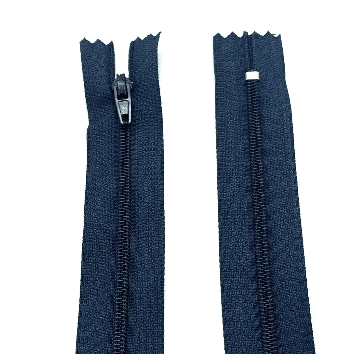 Photo of navy nylon zips available in 25 colors and 5 sizes. Excellent quality zippers for craft and dressmaking purposes. Perfect for dresses, skirts, trousers, bags, purses, cushions, and numerous other projects. So many possibilities, so little time!