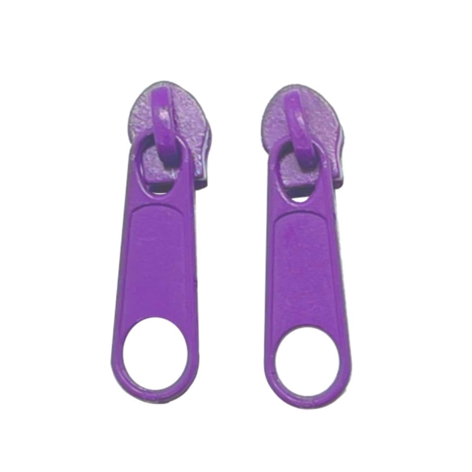 Purple continuous zipper in the standard style with teeth coil exposed.