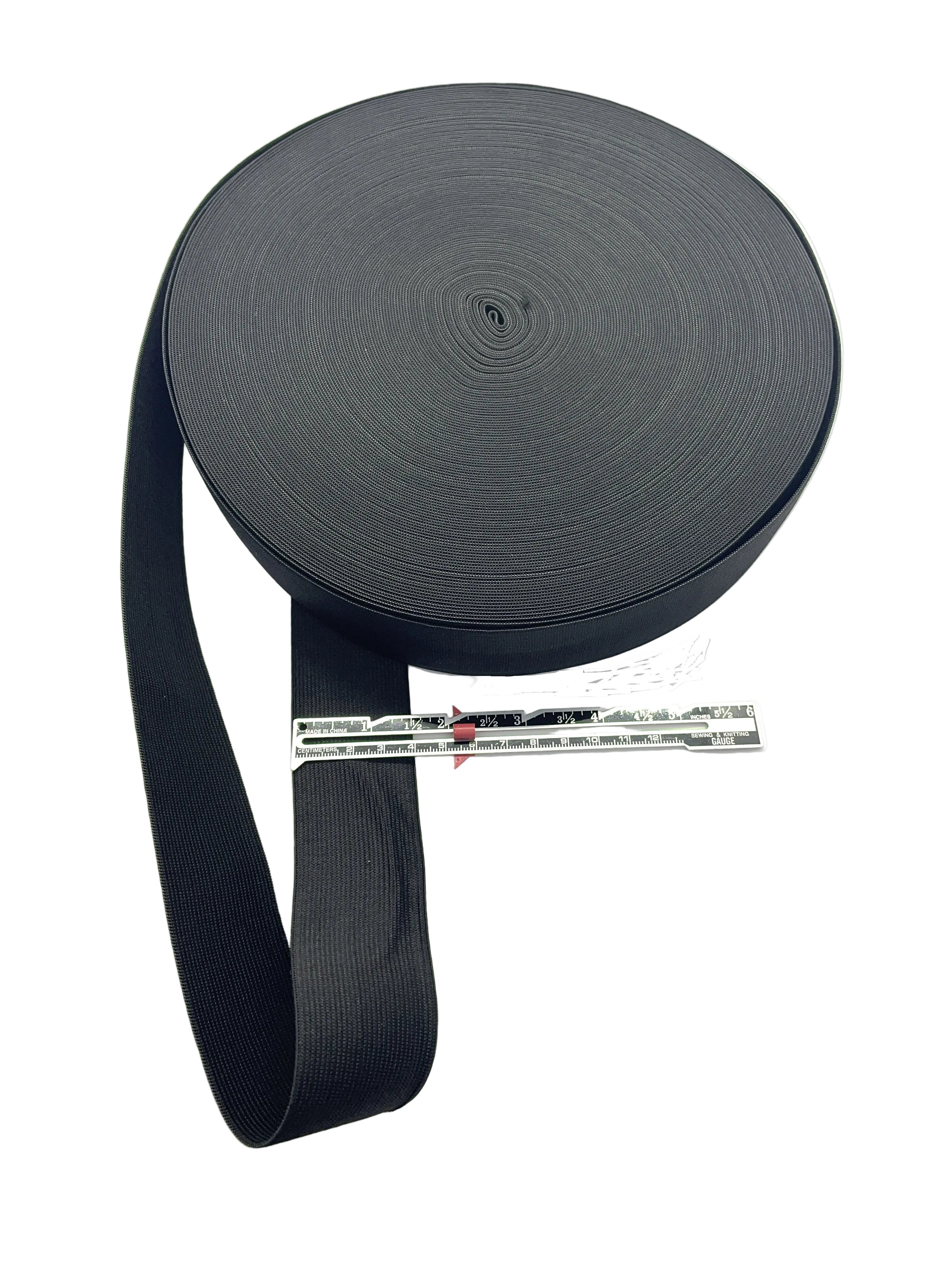 Black webbing roll with a measuring tape on a white background