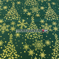 measuring the christmas trees on the green background.