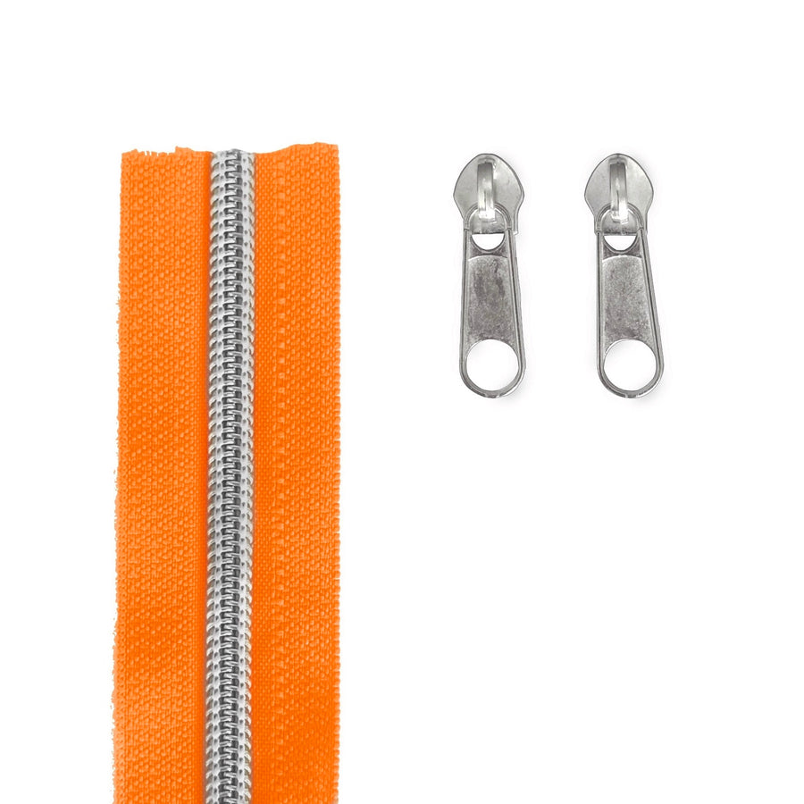 Bright orange zipper tape with a silver metal zipper track and two matching silver metal zipper pulls on a white background.