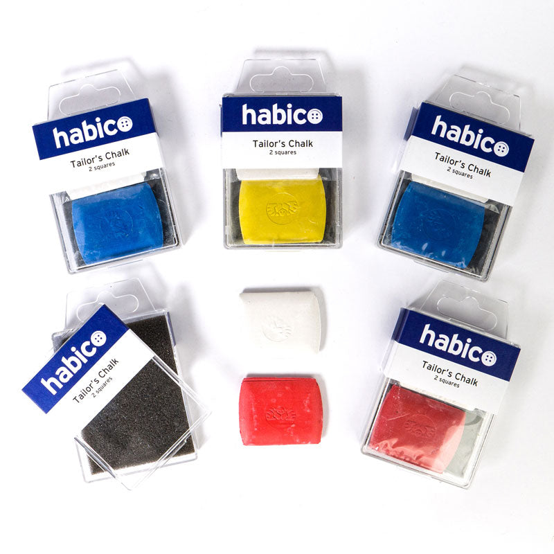 Six packages of habic® Tailor's Chalk erasers arranged on a white background, showing the blue, yellow, dark gray, white, red, and pink chalks in their clear plastic packaging with blue-and-white labels.