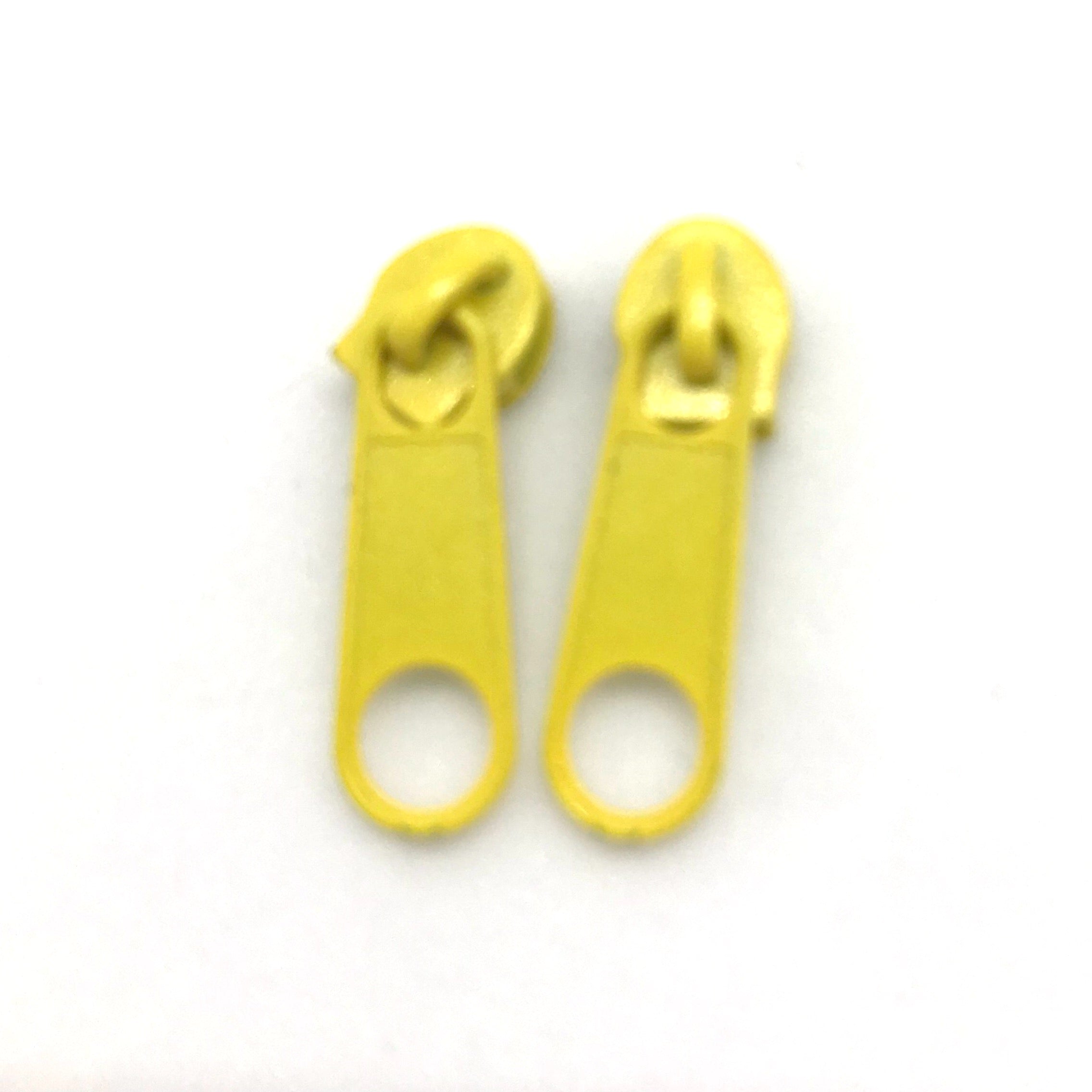 Yellow continuous long chain zipper tape and sliders