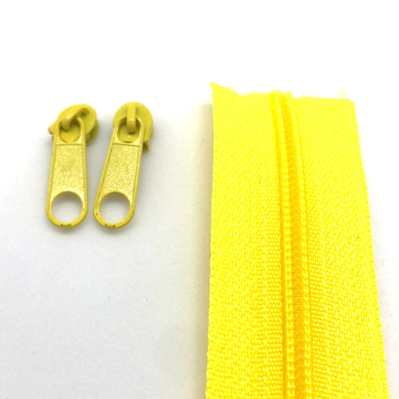 Yellow continuous long chain zipper tape and sliders