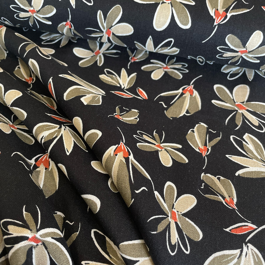 This fabric is a beautiful combination of linen, washed viscose, and black floral print. The linen provides a natural and breathable quality to the fabric, while the washed viscose adds a luxurious and soft touch. The black floral print adds a touch of elegance and femininity to the fabric.