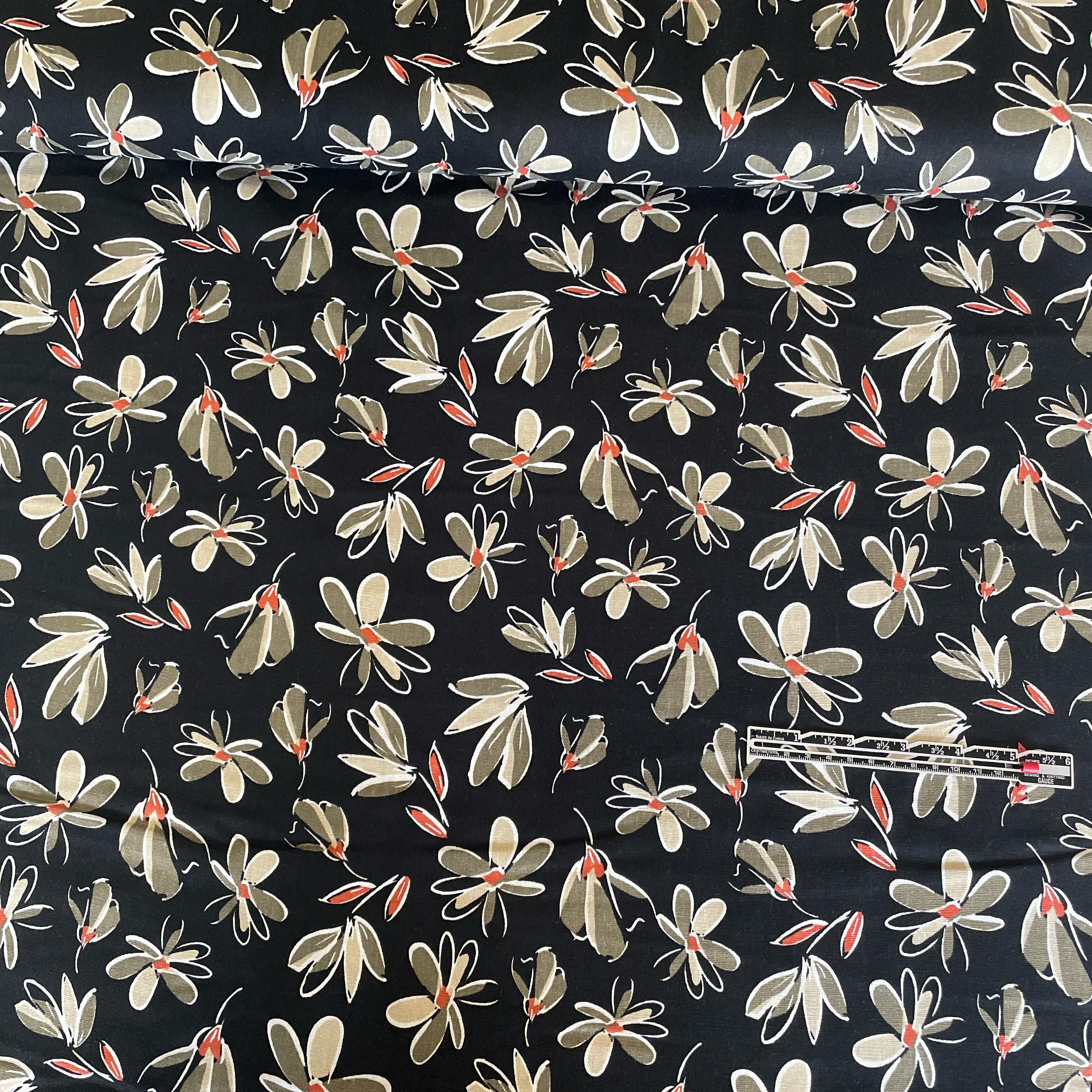 This fabric is a beautiful combination of linen, washed viscose, and black floral print. The linen provides a natural and breathable quality to the fabric, while the washed viscose adds a luxurious and soft touch. The black floral print adds a touch of elegance and femininity to the fabric.