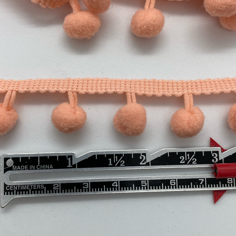 coral pom pom trim for embellishing your projects