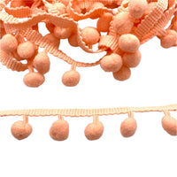 coral pom pom trim for embellishing your projects