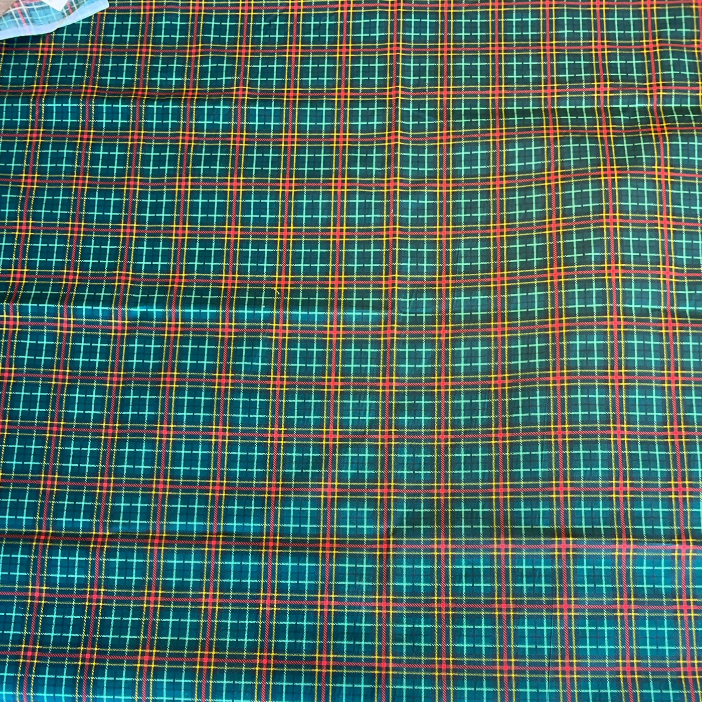 Plaid fabric with green, red, and blue pattern