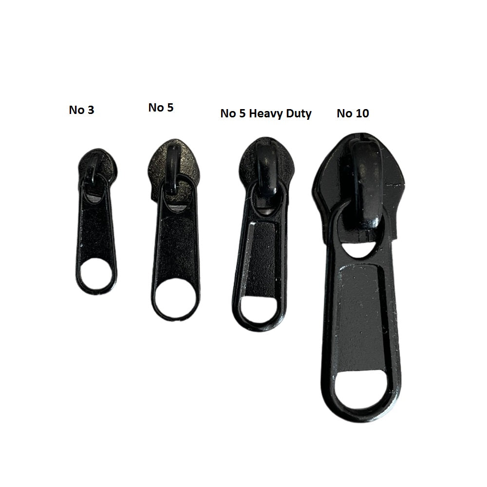 Four black zipper pullers of different sizes on a white background