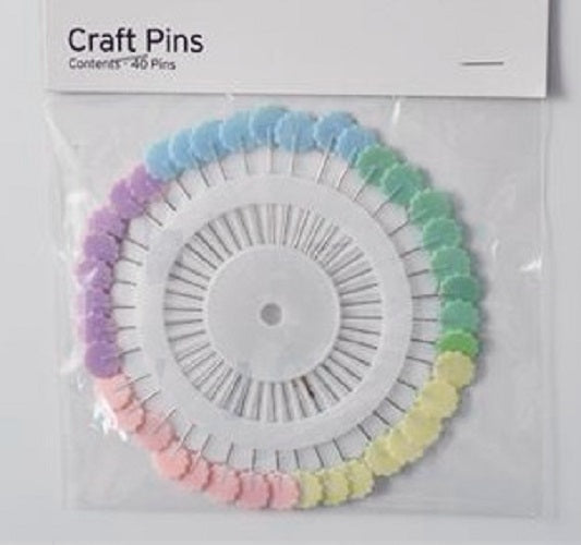 Flower flat headed craft pins in a rosette in 4 colours.