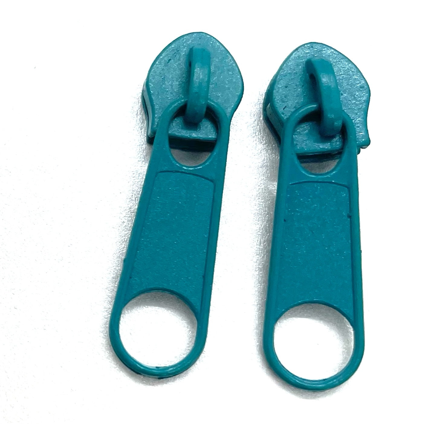 teal continuous long chain zipper tape and sliders in size 3 and 5