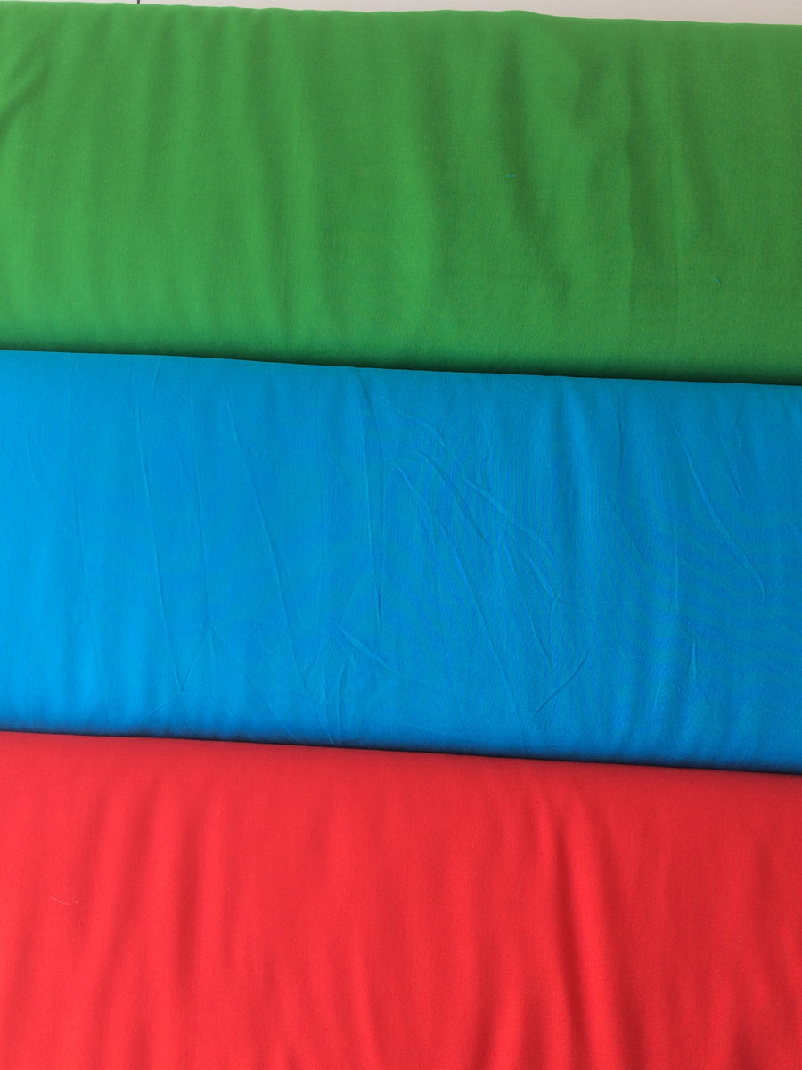 plain viscose fabric in green turquoise and red